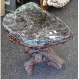 A Chinese root wood stool with mineral top. 53 cm wide.