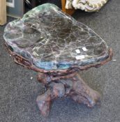 A Chinese root wood stool with mineral top. 53 cm wide.