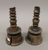 A pair of treen fruitwood candlesticks. 17 cm high.