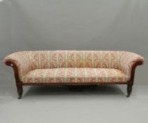 A Victorian oak framed settee. 223 cm wide. The property of Germaine Greer.