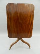 A Georgian mahogany rectangular tilt-top table. 92 cm long.