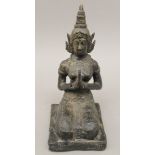 A bronze model of a deity. 25 cm high.