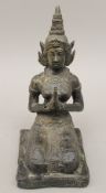 A bronze model of a deity. 25 cm high.