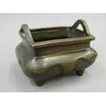 A Chinese bronze rectangular shaped censer. 11 cm high.