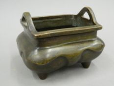 A Chinese bronze rectangular shaped censer. 11 cm high.