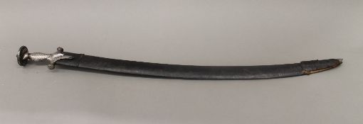 An 18th century silver Koftgari hilted Tulwar. 92 cm long.