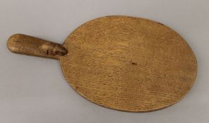 A Mouseman cheeseboard. 39.5 cm long.