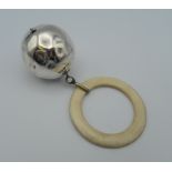 A silver babies rattle. 26.5 grammes total weight.