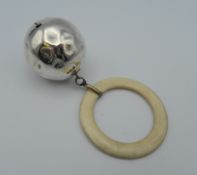 A silver babies rattle. 26.5 grammes total weight.