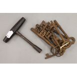 A bunch of eleven antique iron keys.