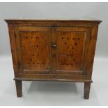 An 18th century oak food cupboard. 93.5 cm wide.