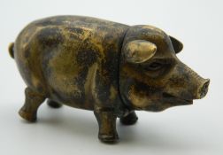 A brass vesta formed as a pig. 6 cm long.