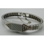 A 14 ct white gold and diamond Lafemme ladies wristwatch. 1 cm wide. 22.2 grammes total weight.