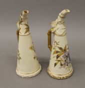 Two Royal Worcester blush ivory ewers. Each 23 cm high.