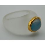 A crystal gold and blue cabochon ring. Ring Size M/N.