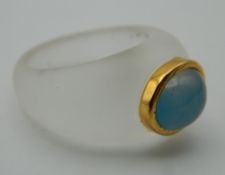 A crystal gold and blue cabochon ring. Ring Size M/N.