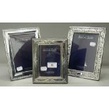 Three modern sterling silver photograph frames. The largest 17.5 cm x 22 cm.