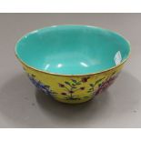 A Chinese yellow porcelain bowl. 16 cm diameter.