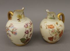 Two large Royal Worcester blush ivory florally decorated jugs. The largest 21 cm high.