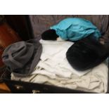 A quantity of vintage clothing, hats, etc.