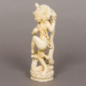 A late 19th/early 20th century Indian ivory figure Modelled as a scantily clad woman wearing a