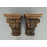 A pair of carved wooden corbels. Each 52 cm high.