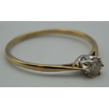 A 9 ct gold 0.25 carat diamond solitaire ring. Ring Size P. 1 gram total weight.