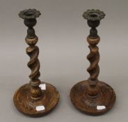 A pair of oak barley twist candlesticks. 29 cm high.