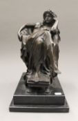 A bronze model of a girl draped in a chair. 40 cm high.