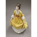 Five Royal Doulton porcelain figurines. The largest 22.5 cm high.