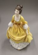 Five Royal Doulton porcelain figurines. The largest 22.5 cm high.