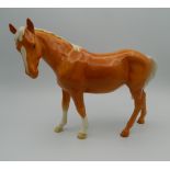 A Beswick porcelain model of a horse. 18 cm high.