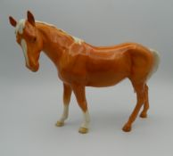 A Beswick porcelain model of a horse. 18 cm high.