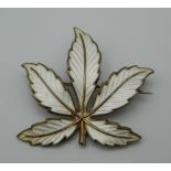 A Norwegian enamel leaf form brooch. 4.5 cm high.