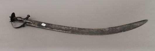 An 18th century all steel fighting Tulwar. 86.5 cm long.