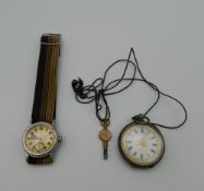 A 935 silver fob watch and a Steger wristwatch. The former 3.5 cm diameter.