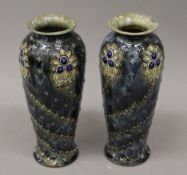 A pair of Art Nouveau Doulton Lambeth vases. 25 cm high.