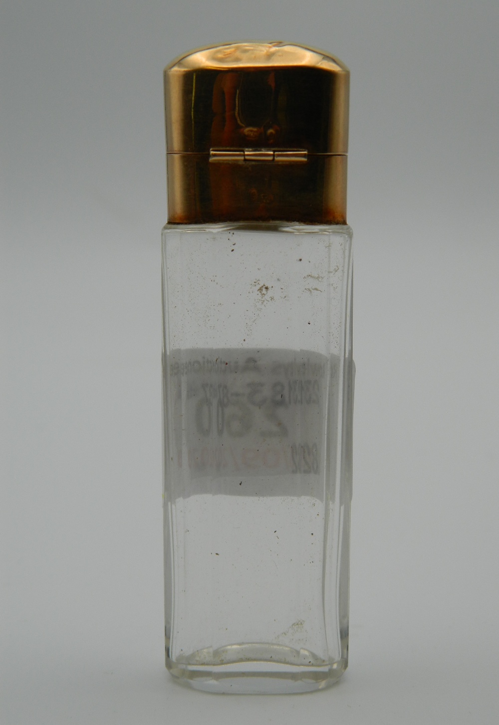 A facet cut glass scent bottle with gold top. 8.75 cm high. - Image 2 of 5