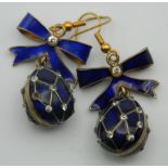 A pair of silver and enamel egg form earrings. 3 cm high.