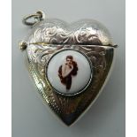 A silver heart shaped vesta decorated with a lady. 4 cm high.