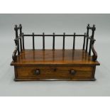 A 19th century rosewood book rack. 43 cm wide.