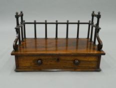 A 19th century rosewood book rack. 43 cm wide.