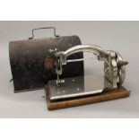 A cased Ideal sewing machine. 25 cm wide.