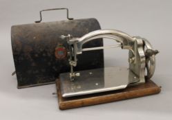 A cased Ideal sewing machine. 25 cm wide.