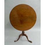 A Georgian mahogany tilt-top table. 80 cm diameter, 71.5 cm high.