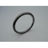 A Charles Horner silver bangle. 19.4 grammes.