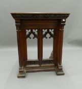 A Victorian carved oak lectern. 68.5 cm wide, 84 cm high, 61 cm deep.