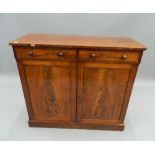 A Victorian mahogany side cabinet. 102.5 cm wide. The property of Germaine Greer.