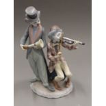 A Lladro clown musician group.