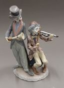 A Lladro clown musician group.